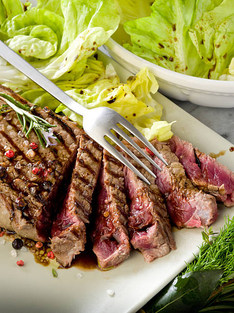 istock sliced steak with balsamic vinegar and green salad 154166189