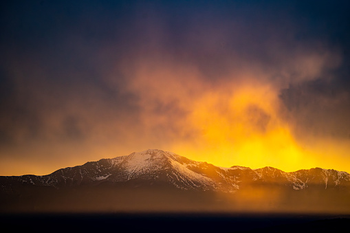 Hazy dramatic sunset viewing Pikes Peak