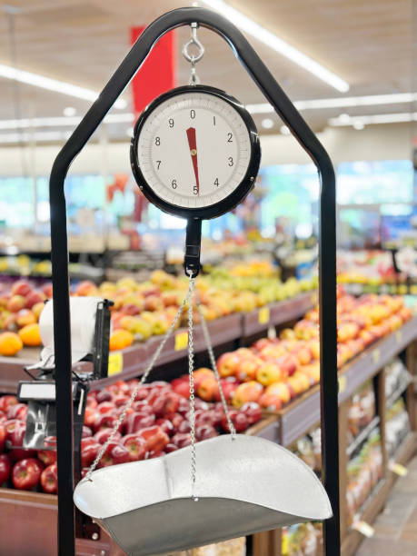 Grocery scale in a supermarket Weight scale in front of groceries in supermarket vintage kitchen scale with fruit stock pictures, royalty-free photos & images