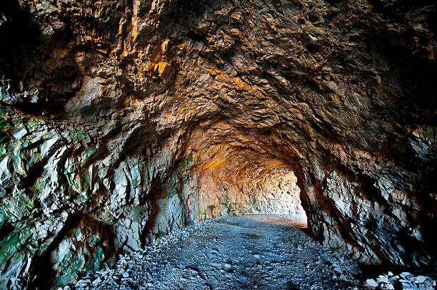 Mine Light Coming from the Entrance to the Mine grotto cave photos stock pictures, royalty-free photos & images