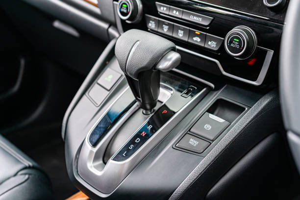 istock automatic transmission shift selector in the car interior. Closeup a manual shift of modern car gear shifter. 4x4 gear shift 1541740676