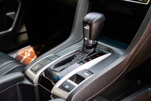 istock automatic transmission shift selector in the car interior. Closeup a manual shift of modern car gear shifter. 4x4 gear shift 1541740746