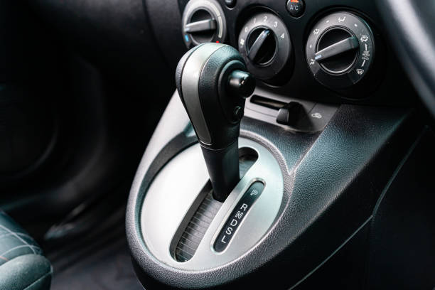 istock automatic transmission shift selector in the car interior. Closeup a manual shift of modern car gear shifter. 4x4 gear shift 1541741259