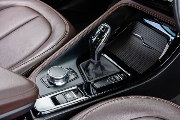 istock automatic transmission shift selector in the car interior. Closeup a manual shift of modern car gear shifter. 4x4 gear shift 1541741261