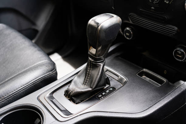istock automatic transmission shift selector in the car interior. Closeup a manual shift of modern car gear shifter. 4x4 gear shift 1541742295