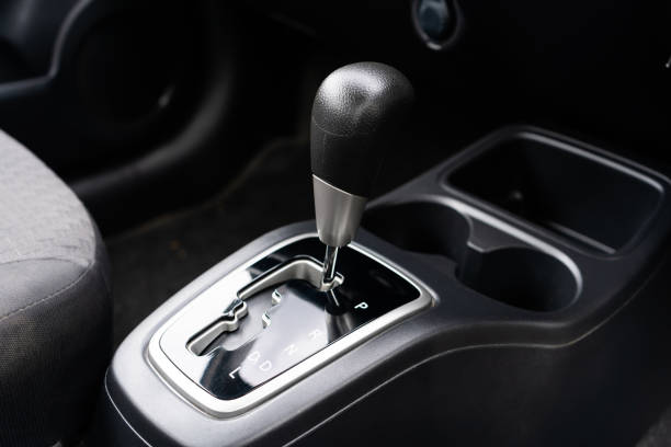 istock automatic transmission shift selector in the car interior. Closeup a manual shift of modern car gear shifter. 4x4 gear shift 1541744909