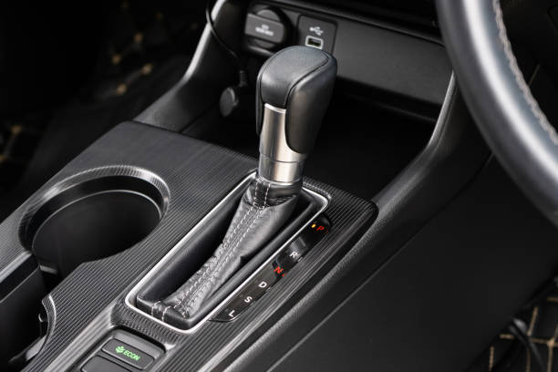 istock automatic transmission shift selector in the car interior. Closeup a manual shift of modern car gear shifter. 4x4 gear shift 1541744915