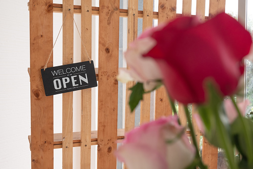 Open sign of flower shop, Small business flower shop with the sign of the shop open for service.