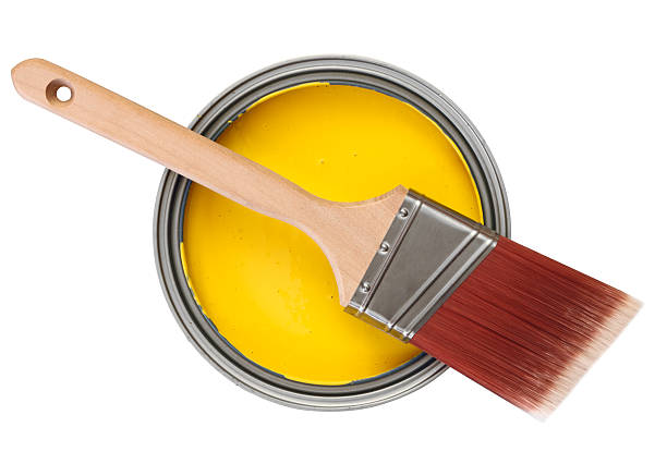 istock yellow paint can with painbrush 154180019