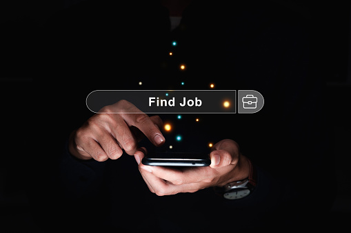 Businessman using smartphone Find job information, Job search and recruitment concept.
