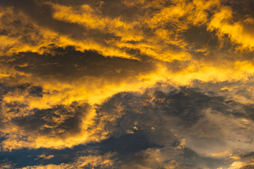 Panoramic views of the skyline at sunset and dusk. The sky during sunset is cloudy with many colors and beautiful cloud patterns.