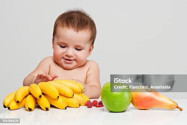 Happy Baby With Fruits Stock Photo - Download Image Now - 6-11 Months, Apple - Fruit, Babies Only