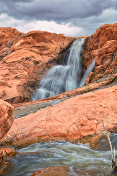 istock Gunlock Falls State Park Reservoir waterfall views, Utah by St George. 2023 record snowpack spring run off over desert erosion sandstone. Utah, USA. 1541867221
