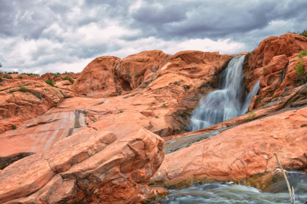 istock Gunlock Falls State Park Reservoir waterfall views, Utah by St George. 2023 record snowpack spring run off over desert erosion sandstone. Utah, USA. 1541867270