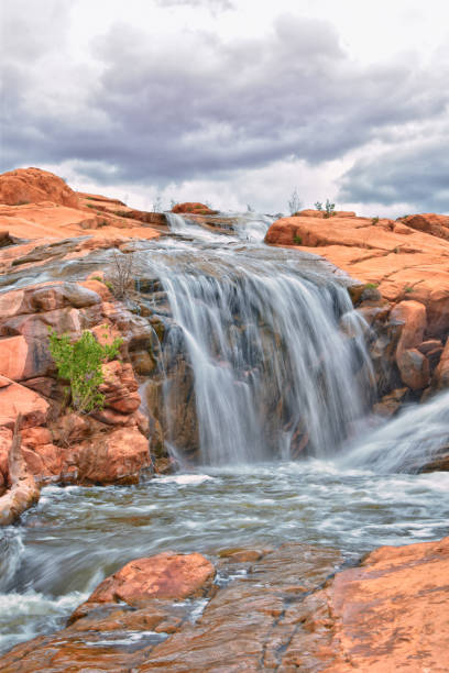 istock Gunlock Falls State Park Reservoir waterfall views, Utah by St George. 2023 record snowpack spring run off over desert erosion sandstone. Utah, USA. 1541867272