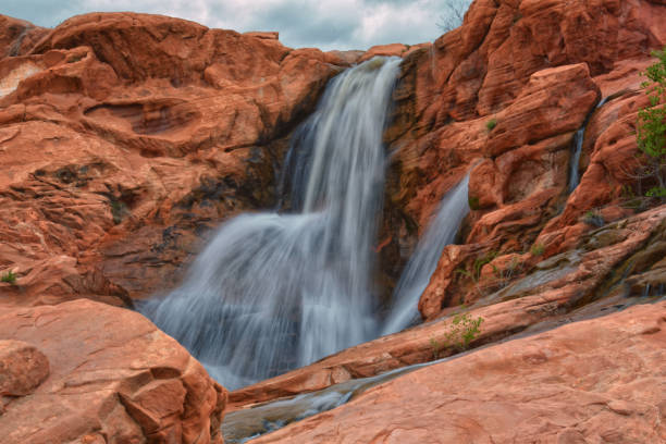 istock Gunlock Falls State Park Reservoir waterfall views, Utah by St George. 2023 record snowpack spring run off over desert erosion sandstone. Utah, USA. 1541867388