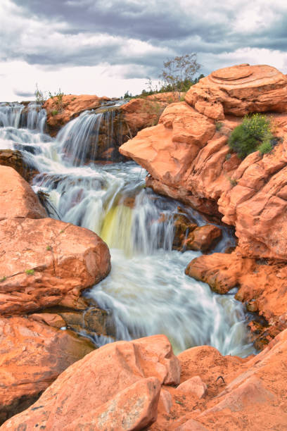 istock Gunlock Falls State Park Reservoir waterfall views, Utah by St George. 2023 record snowpack spring run off over desert erosion sandstone. Utah, USA. 1541867518