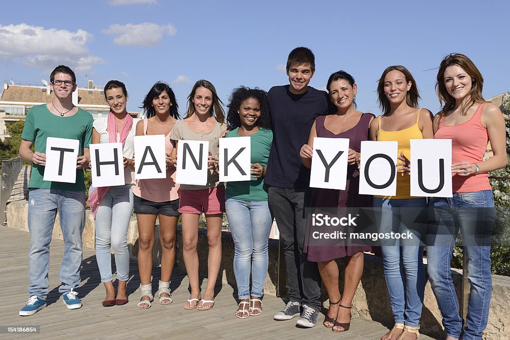 Group of people saying Thank You Group of diverse people holding sign Thank You Thank You - Phrase Stock Photo