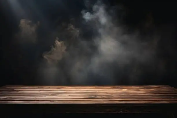 Photo of Empty wooden table with smoke floats up for displaying your products.