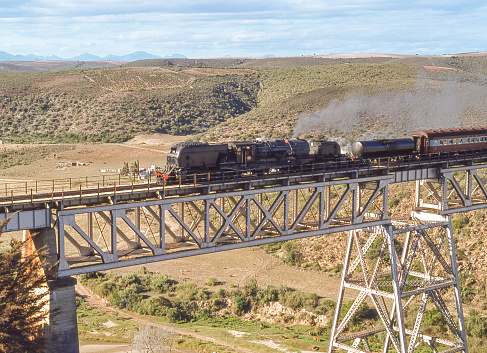 A steam engine crossing a railway bridge near Mossel Bay in the Western Cape Province of South Africa.