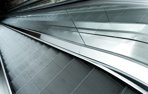 Modern automatic escalator system in shopping mall.