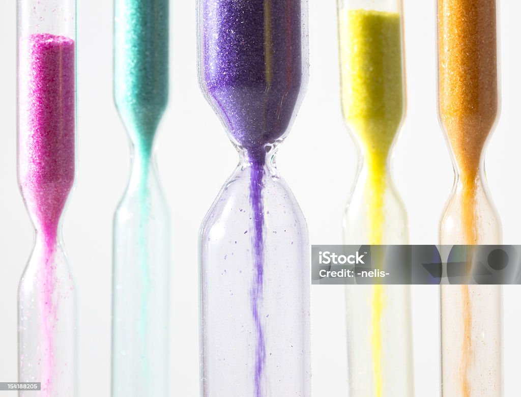 Hourglasses with different colored sand time is slipping away, colorful hourglasses Hourglass Stock Photo