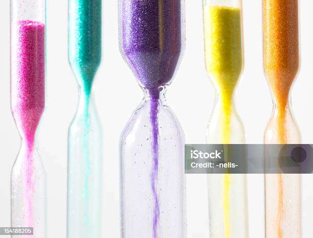 Hourglasses With Different Colored Sand Stock Photo - Download Image Now - Hourglass, Multi Colored, Pink Color