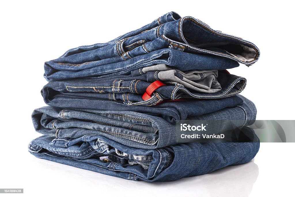 Stack of jeans Pile of trousers made of blue denim jeans Blue Stock Photo