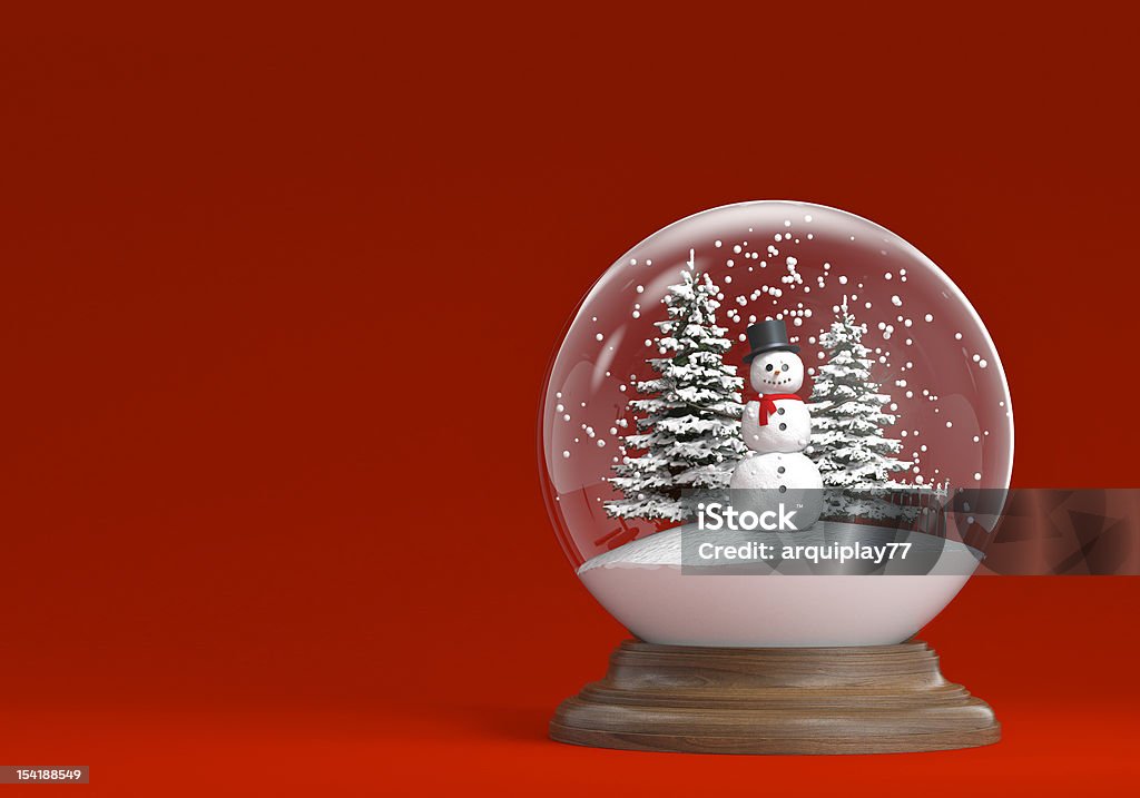 snowglobe with snowman and trees on red snowglobe whit snowman and trees on a red background with copy space, clipping path included Snow Globe Stock Photo