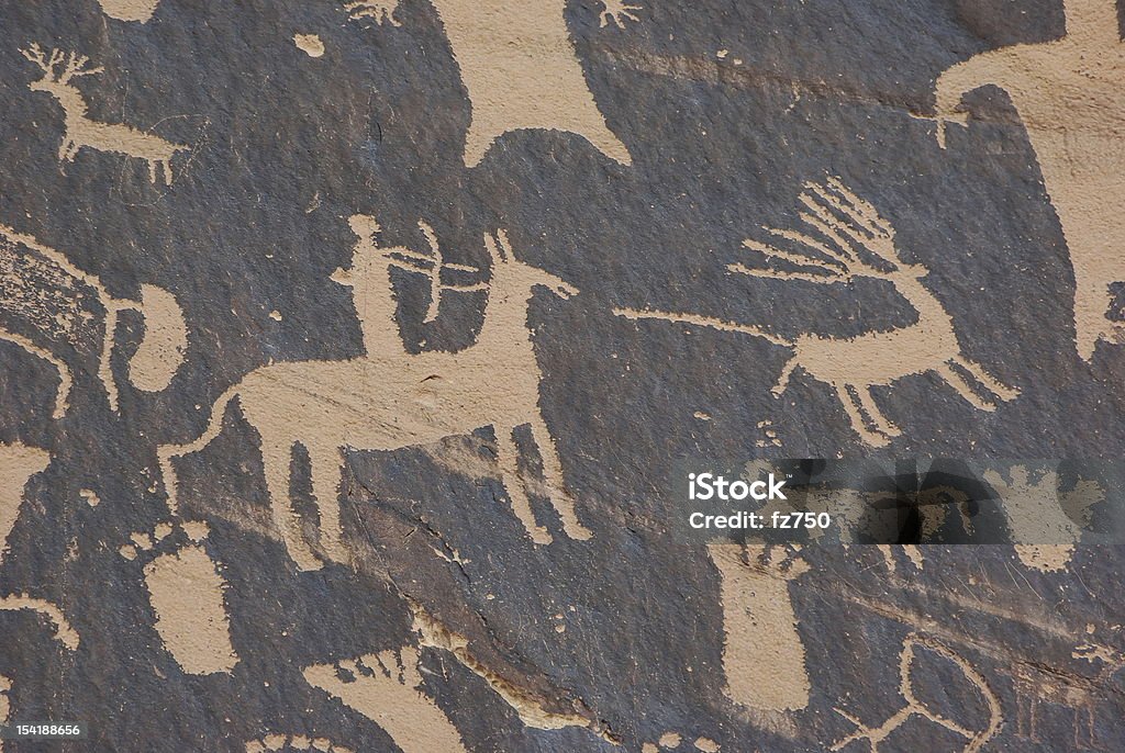 Newspaper Rock Newspaper Rock is a petroglyph panel etched in sandstone that records approximately 2,000 years of early human activities.  It is located near the Needles section of Canyonlands National Park in Utah, USA. Cave Painting Stock Photo