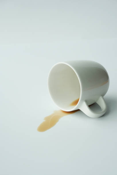 istock cup of coffee spilled on white background 1541901611