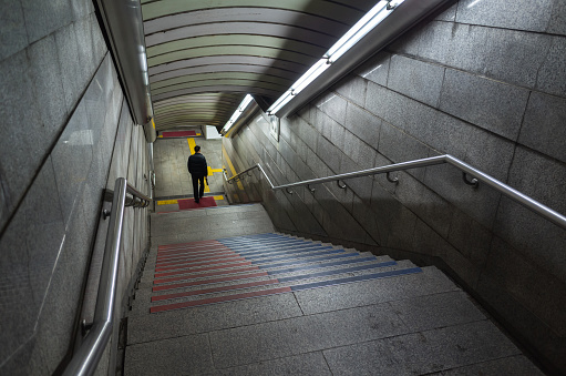 Busan, South Korea - March 19, 2018: A man goes down to subway