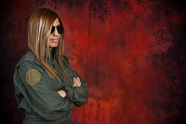 Pilot Beatifull woman pilot with sun glasses in front of red and black background beatifull stock pictures, royalty-free photos & images