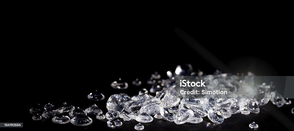 Diamonds on a black background with copy space Diamonds on a black background with copy space close up Artificial Stock Photo