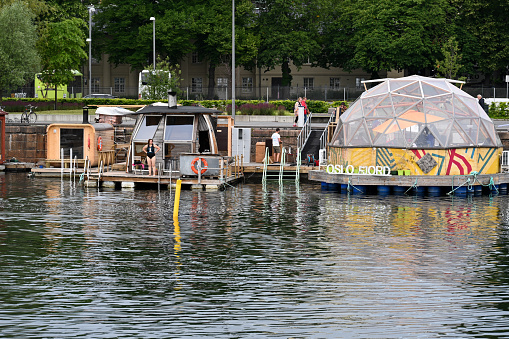Oslo, Norway, July 3, 2023 - Oslo's floating saunas in the harbor near the Opera House.
