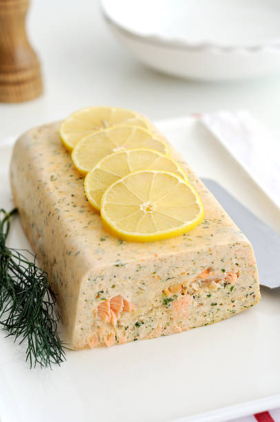 Fresh and smoked salmon terrine garnish whith lemon