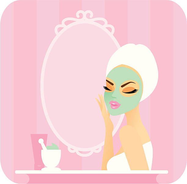 Skincare series-Mask Young woman with a towel over her hair applying a facial mask in front of a vanity mirror. On the counter are some tools and ingredients for making a homemade organic mask. facial mask woman stock illustrations