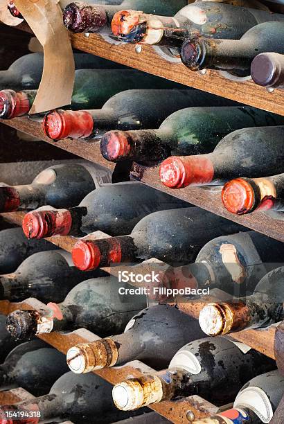Dusty Old Bottles Of Wine Stock Photo - Download Image Now - Wine, Alcohol - Drink, Bottle