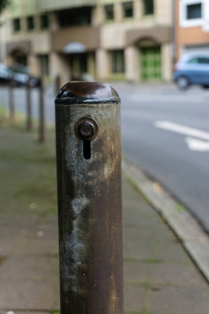 istock Old metal pillars on the street 1541944090