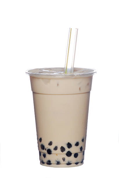 Light brown, pearl, milk tea with a straw Pearl Milk Tea is Taiwan's most famous drink  bubble tea photos stock pictures, royalty-free photos & images