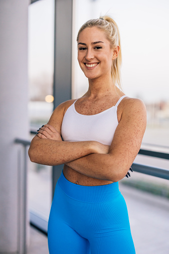 Portrait of a happy woman in the gym wearing sportswear