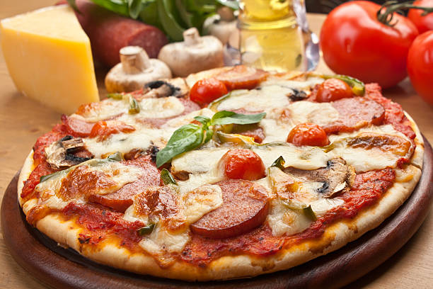 istock salami, mushroom and vegetable pizza 154197413
