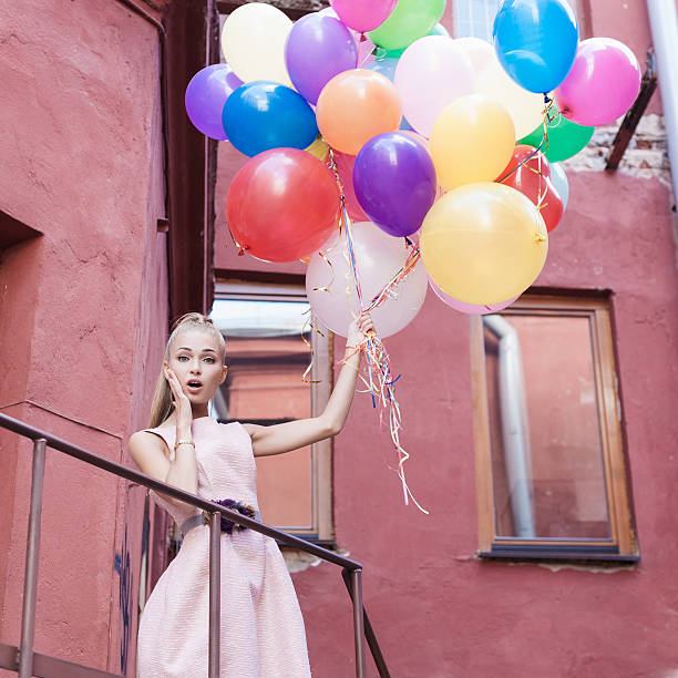 istock woman with balloons 154197545