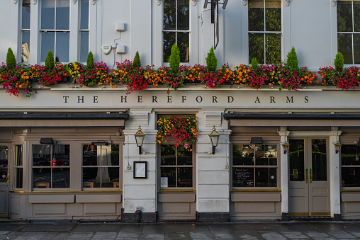 London, UK - October 01 2022: Pub and restaurant The Hereford Arms in South Kensington on a cloudy autumn day. Beautiful historical facade in London city centre.