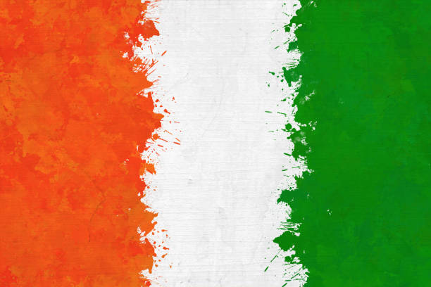 istock Horizontal backgrounds of tricolor vertical bands, in bright smudged orange or saffron, white and green colors as in National Flag of India, like messy water color paint  splattered on a plain white textured paper background 1541980290