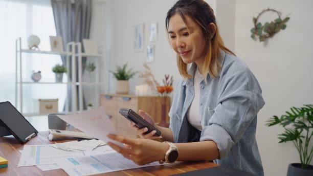 istock Woman use smartphone scan QR code for make online utility bill payment,contactless Internet banking  technology and money transfer 1541989144
