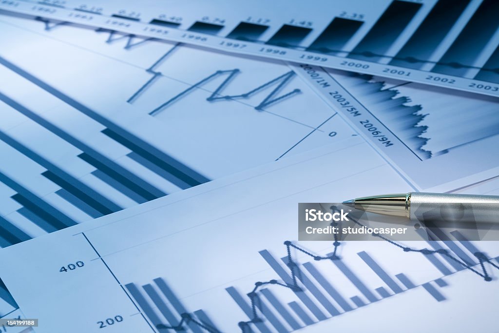 Various types of graphs and charts on white paper graphs and charts Bar Graph Stock Photo