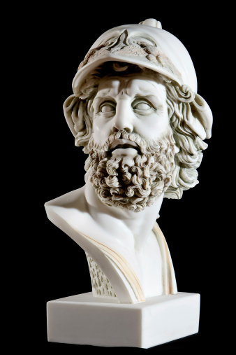 Classical painted marble Zeus Bust isolated on black background.