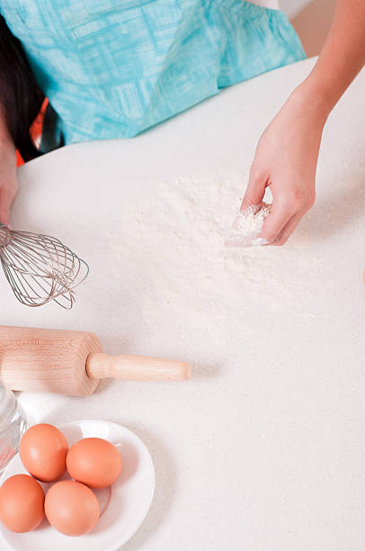 istock Woman hands mixing flour on the table 154203000