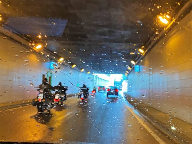 istock Motorcyclist on route in the rain 1542042950